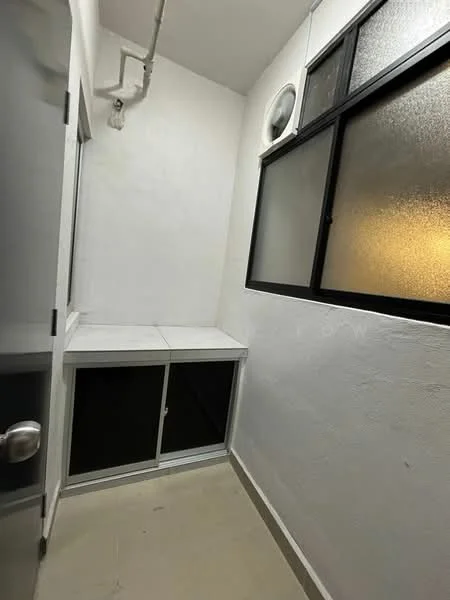 Room features: white painted walls, tile flooring, large window with black frame, built-in white cabinetry, wall-mounted air conditioning unit.