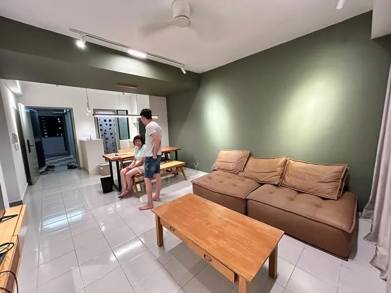 Living features: L-shape sectional sofa in brown, wooden coffee table, white tiled flooring, green accent wall, recessed downlights, ceiling fan, dining table with benches, floor-to-ceiling windows, curtains, open layout to kitchen; style: modern. Room features: white walls, doorway leading to hallway, visible kitchen area.