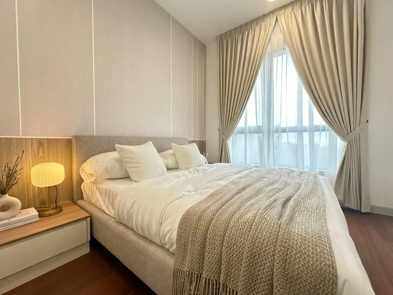 Bedroom features: king-size bed, upholstered headboard, white bedding, decorative throw blanket, bedside table, table lamp with warm light, floor-to-ceiling windows, curtains in light beige, wooden flooring, wall with light beige paneling; style: modern; view: city.