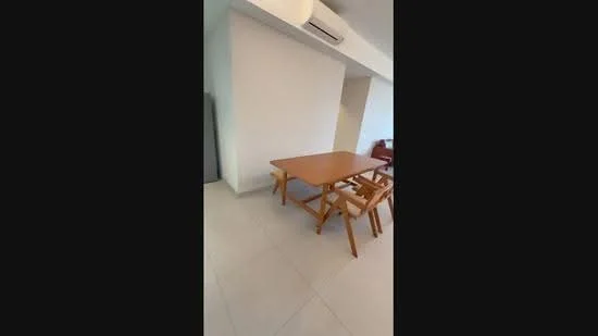 Dining features: wood dining table, 4 wooden dining chairs, light-colored tiled flooring, wall-mounted air conditioning unit, plain white walls, natural light from window, minimalist decor; style: modern.
