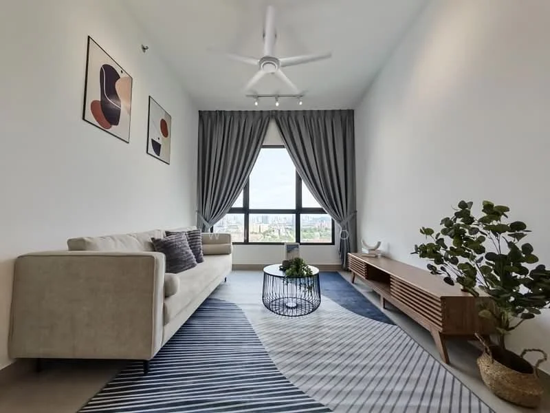 Living features: 3-seater fabric sofa in beige, decorative cushions, coffee table with wire frame, area rug with geometric pattern, wall-mounted TV console, decorative plants in ceramic pot, floor-to-ceiling windows, grey curtains, 5-blade ceiling fan with light, framed artwork on walls; style: modern; view: city.