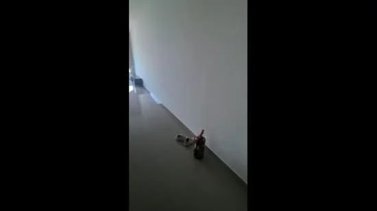 Room features: white painted walls, grey tile flooring.