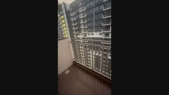 Balcony features: metal railing, tiled flooring, overlooking building facade, sheltered area, access from living room, sufficient space for outdoor furniture; style: modern; view: city.