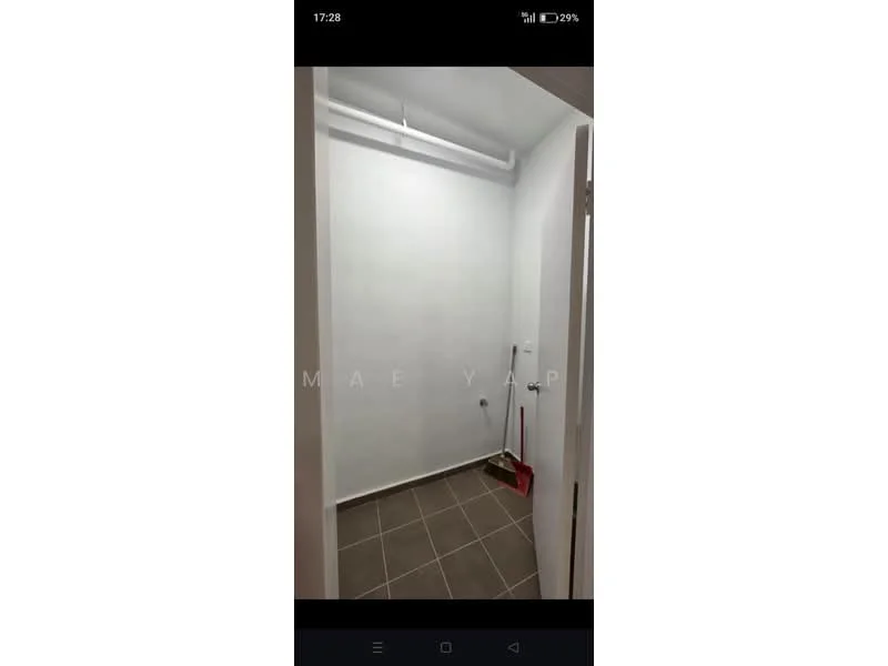 Room features: white painted walls, grey floor tiles, ceiling light fixture, wall-mounted electrical outlet, clean and minimalistic design, no visible windows, door leading to another space; style: modern.