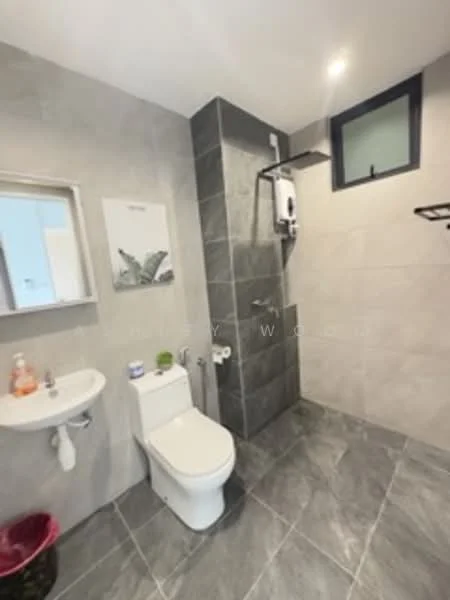 Bathroom features: grey ceramic tile flooring, grey wall tiles, white toilet, chrome showerhead, glass shower enclosure, wall-mounted shower mixer, small sink with wall-mounted faucet, mirror above sink, towel rack, window for natural light; style: modern.