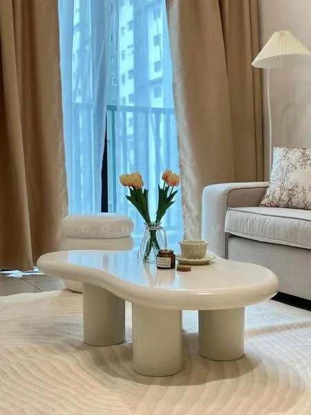 Living features: beige fabric sofa, decorative throw pillows, white organic-shaped coffee table, vase with flowers, light-colored area rug, floor-to-ceiling windows, sheer curtains, table lamp with pleated shade; style: modern; view: city.