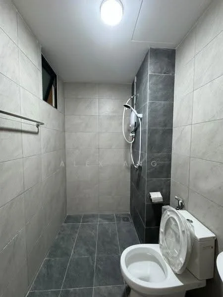 Bathroom features: grey tile flooring, light grey wall tiles, dark grey accent wall, shower with wall-mounted shower head, toilet with dual flush, wall-mounted soap holder, single light fixture, window for natural light; style: modern.