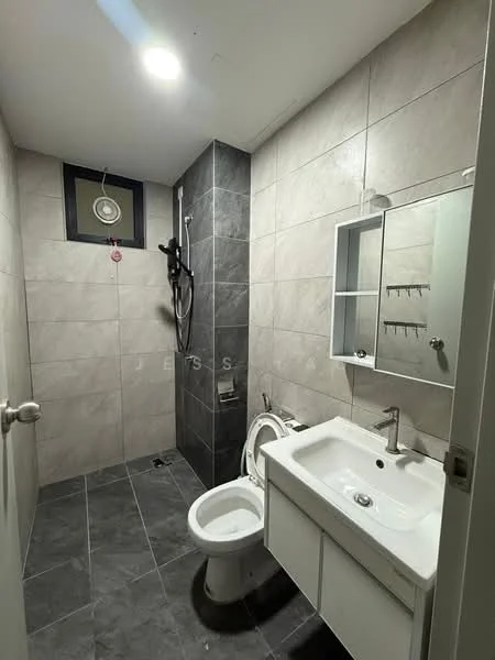 Bathroom features: grey tile flooring, light grey wall tiles, dark grey accent wall, single-sink vanity with white cabinet, chrome basin mixer faucet, framed mirror above vanity, one-piece toilet, shower area with wall-mounted showerhead, shower wall with tile cladding, ceiling light fixture; style: modern.