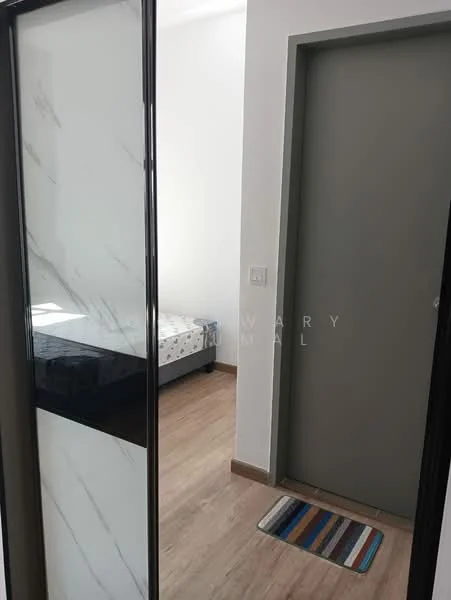 Room features: wooden flooring, white walls, grey door, sliding glass door with marble pattern, bed visible in adjacent room, door mat.
