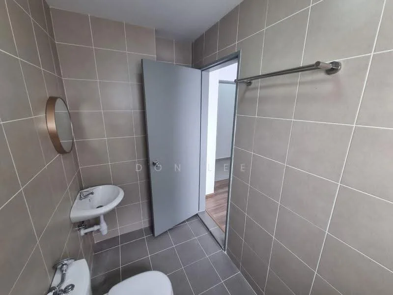 Bathroom features: grey tiled walls, grey tiled flooring, white pedestal sink, chrome faucet, round mirror, white toilet, towel rail, door to adjacent room; style: modern.