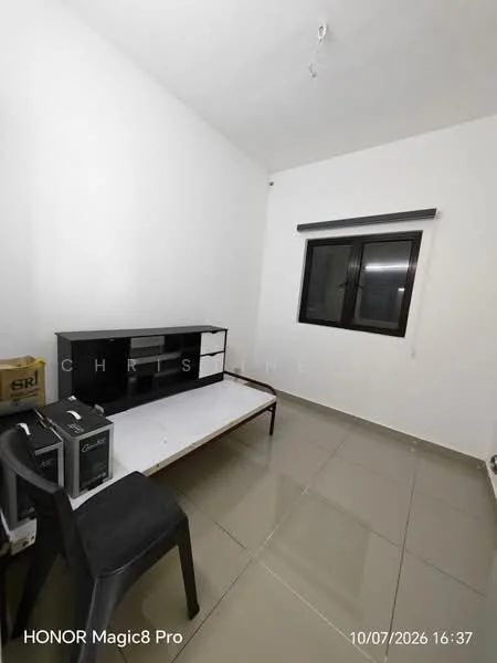 Room features: white painted walls, grey tiled flooring, single window with black frame, black window blinds, black TV console, empty space for furniture, plastic chair, box storage.