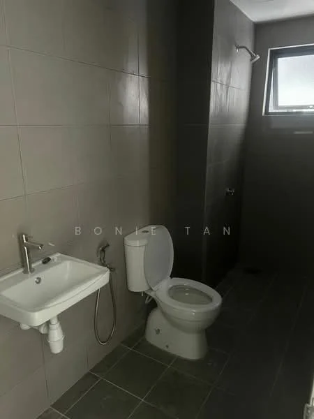 Bathroom features: grey tiled walls, grey tiled flooring, white toilet, single-sink vanity with chrome faucet, shower area with wall-mounted shower head, window for natural light, bidet spray, wall-mounted towel rack; style: modern.