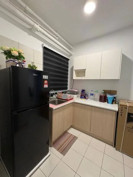 Kitchen features: black refrigerator, single-bowl stainless-steel sink, chrome pull-down faucet, laminate countertop, upper cabinets in white, lower cabinets in light wood, tile backsplash, ceramic tile flooring, window with black roller blinds, decorative plant on countertop, dish drying rack, various kitchen containers; style: modern.