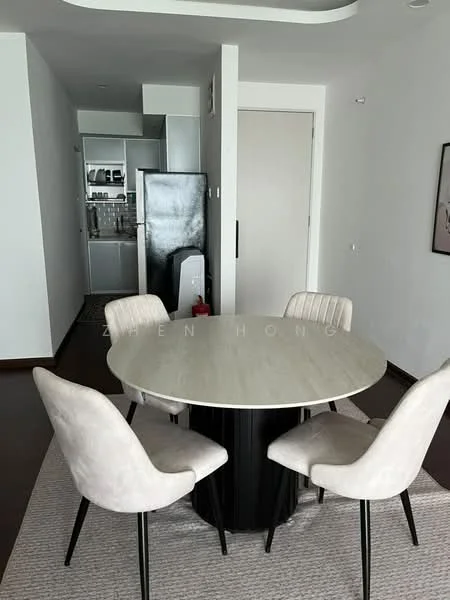 Dining features: round dining table with marble top, 4 upholstered dining chairs in light fabric, area rug with neutral color, white painted walls, dark wood flooring, recessed ceiling lights, open layout to kitchen, wall-mounted artwork; style: modern. Kitchen features: stainless-steel fridge, built-in cabinetry, countertop with storage, open layout to dining area; style: modern.