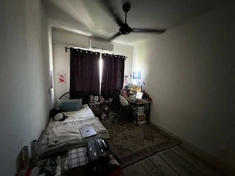 Bedroom features: single bed with white bedding, black ceiling fan, dark curtains, wooden flooring, study desk with computer, area rug with geometric pattern, wall-mounted artwork, open closet with clothes, laptop on bed, decorative items on desk.