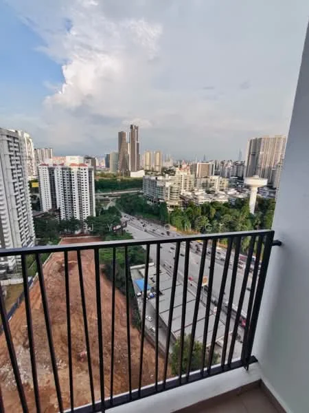 Balcony features: black metal railing, tiled flooring, city skyline view, surrounding greenery, adjacent construction site, high-rise buildings in view, partially cloudy sky; style: modern; view: city.