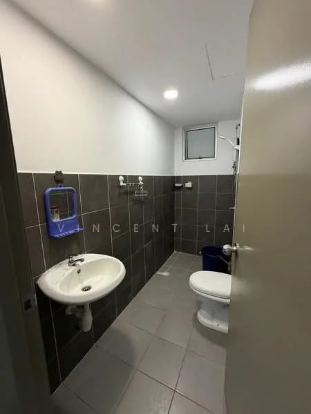 Bathroom features: white wall tiles, grey floor tiles, single-sink vanity, chrome basin mixer faucet, toilet, small window, wall-mounted towel rack, mirror above sink, shower area with glass partition, light fixture in ceiling; style: modern.