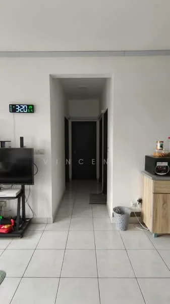 Room features: white painted walls, ceramic tile flooring, wall-mounted TV, TV console, open shelving, microwave, wooden cabinet, grey mat, clock on wall.