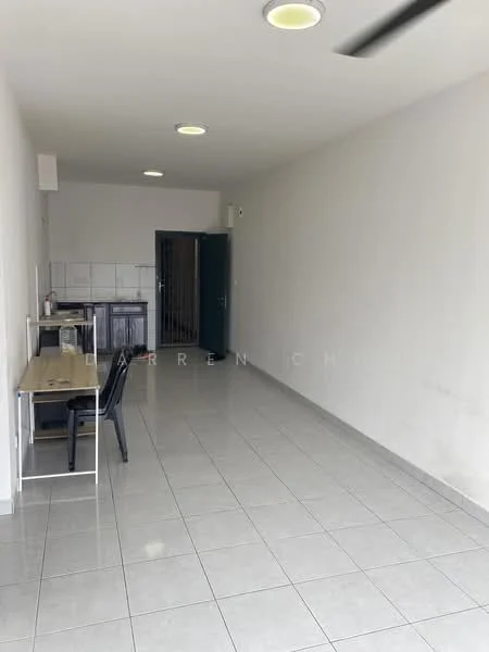 Room features: white painted walls, glossy ceramic tile flooring, recessed ceiling lights, ceiling fan, open layout, kitchenette area with countertop, single wooden table, black plastic chairs, door leading to another room, large window for natural light; style: modern.