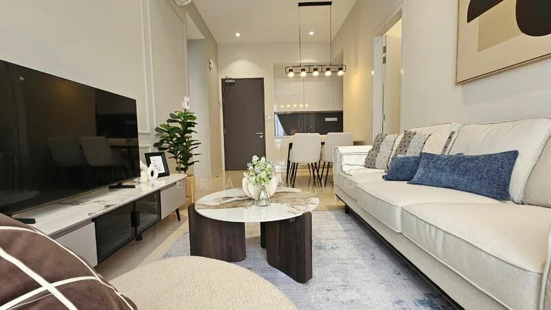Living features: 3-seater fabric sofa in cream, accent pillows in blue and grey, coffee table with round top and dark wood base, area rug with geometric pattern, wall-mounted TV, TV console in white, decorative plant in ceramic pot, dining area visible in background, recessed ceiling lights, pendant light fixture above dining table, neutral wall color, large windows with natural light; style: modern.