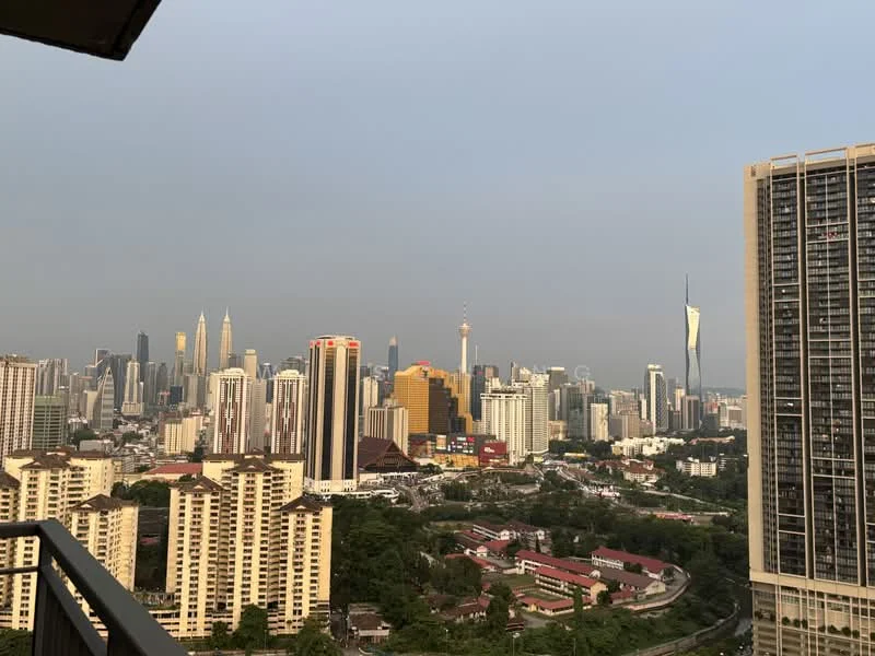 Exterior type: high-rise condominium; features: city skyline view, surrounded by urban landscape, visible high-rise buildings, mixed architectural styles, greenery in the foreground, prominent landmarks in the distance; style: modern.