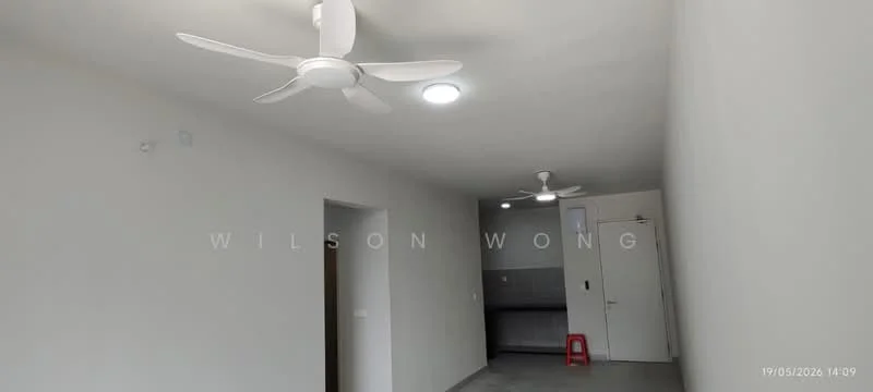 Room features: white painted walls, grey floor tiles, 2 ceiling fans, recessed LED downlights, open layout, kitchen area visible in background, single door, small red stool; style: modern.