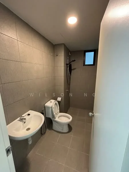 Bathroom features: grey tiled walls, light grey tiled flooring, single-sink vanity with wall-mounted faucet, one-piece toilet, shower area with handheld shower, window for natural light, recessed ceiling light; style: modern.