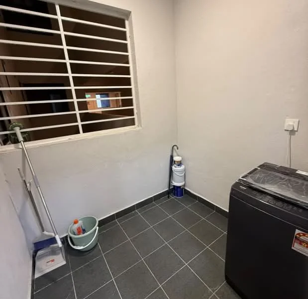 Laundry features: grey ceramic tile flooring, white painted walls, window with security bars, washing machine, laundry bucket, cleaning supplies, water filter, shelf or ledge, plumbing fixtures.