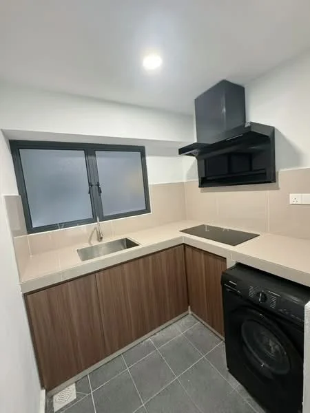Kitchen features: L-shaped countertop, light-colored stone countertop, dark wood cabinetry, built-in black range hood, black washing machine, single-bowl stainless-steel sink, black induction cooktop, grey tiled flooring, white painted walls, window with black frame; style: modern.