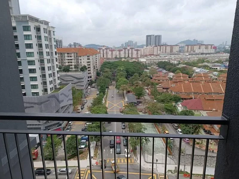 Exterior type: high-rise condominium; features: city skyline view, surrounded by greenery, adjacent to main road, multiple residential buildings in view, balcony railing visible, urban landscape, road with traffic markings; style: modern.