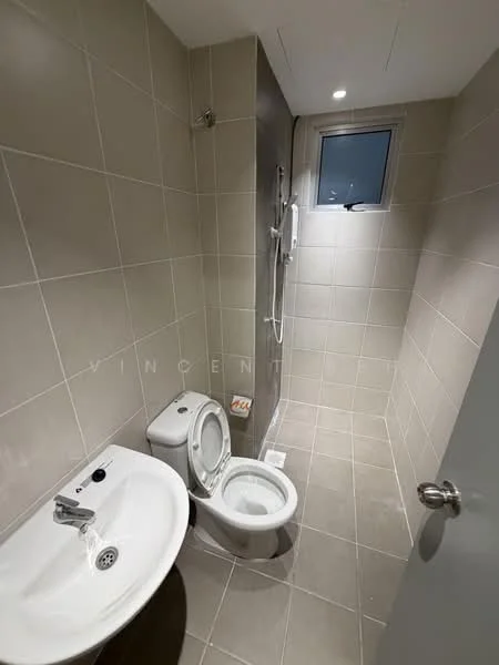 Bathroom features: white ceramic toilet, single-sink vanity with chrome faucet, shower with wall-mounted shower head, grey tiled walls, grey tiled flooring, small window for natural light, recessed ceiling lights, toilet paper holder, soap dish, mirror above sink; style: modern.