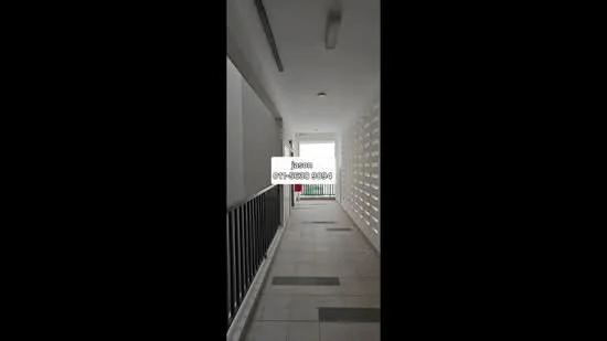 Room features: white painted walls, grey tiled flooring, overhead fluorescent lighting, railing along one side, windows at the end of the corridor, ventilation grilles on the wall; style: modern.