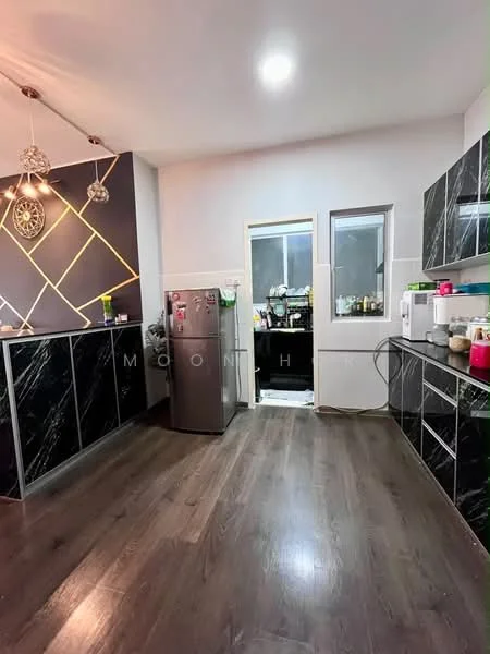 Kitchen features: black marble countertop, black cabinetry with gold accents, stainless-steel fridge, built-in oven, microwave, kitchen sink, pendant lighting, dark wood laminate flooring, wall-mounted cabinets, open shelving, window above sink, door leading to utility area; style: modern.