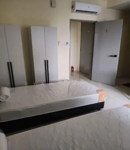 Room features: two single beds with mattresses, grey wardrobes with black handles, light-colored walls, white tiled flooring, wall-mounted air conditioning unit, door leading to another room, fire extinguisher visible, light switch on the wall; style: minimalist.