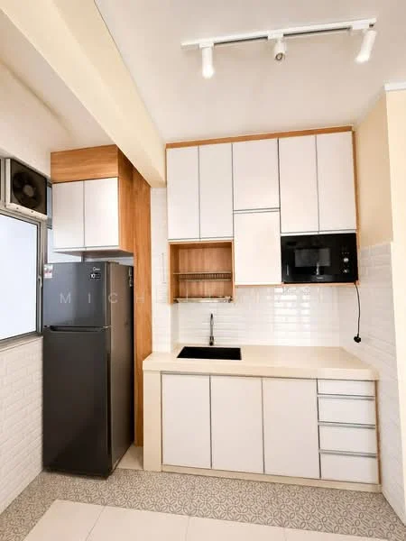 Kitchen features: white cabinetry with wood accents, black single-bowl stainless-steel sink, chrome pull-down faucet, white subway tile backsplash, built-in microwave, black fridge, countertop with light beige finish, under-cabinet lighting, drawer storage, open shelving; style: modern.