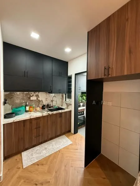 Kitchen features: black upper cabinets, wooden lower cabinets, white marble countertop, single-bowl stainless-steel sink, chrome pull-down faucet, tile backsplash with grey pattern, recessed LED downlights, wooden flooring in herringbone pattern, kitchen rug, window with view to outdoor plants; style: modern; view: garden.