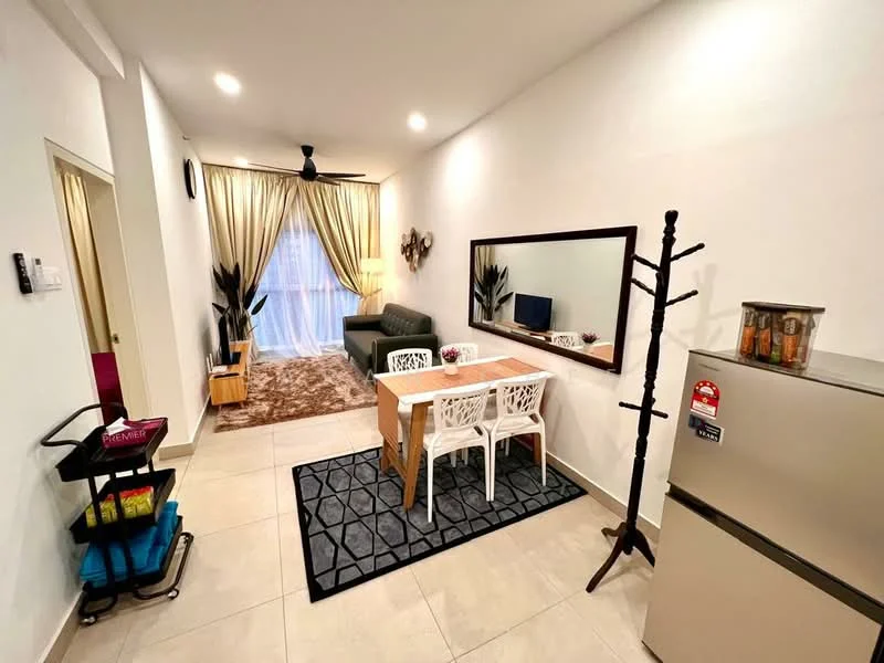 Living features: grey fabric sofa, coffee table, TV console, wall-mounted TV, area rug with geometric pattern, 5-blade ceiling fan with light, floor-to-ceiling window with sheer curtains, decorative mirror, wall clock, decorative plants, dining table with 2 white chairs, refrigerator, coat rack; style: modern.