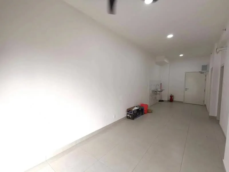 Room features: white painted walls, tile flooring, recessed downlights, single door, fire extinguisher, open space layout, no visible furniture, neutral color scheme; style: modern.
