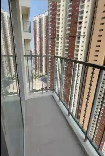 Balcony features: glass railing, tiled flooring, city view, attached to living room, sufficient space for outdoor furniture; style: modern; view: city.