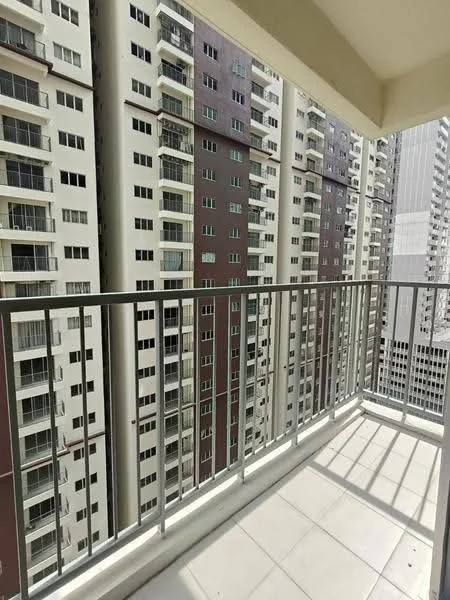 Room features: balcony, metal railing, tiled flooring, concrete walls, floor-to-ceiling windows, city view, sunlight casting shadows, surrounding high-rise buildings; style: modern; view: city.