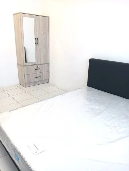 Bedroom features: queen-size bed with mattress, wooden wardrobe with mirror, two drawers in wardrobe, white tiled flooring, plain white walls, natural light from window, minimalist decor; style: modern.