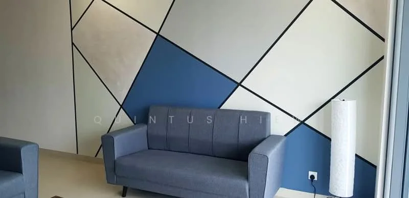 Living features: grey fabric 3-seater sofa, geometric accent wall with blue and white sections, cream painted walls, light-colored flooring, floor lamp with white shade, minimalist decor; style: modern.