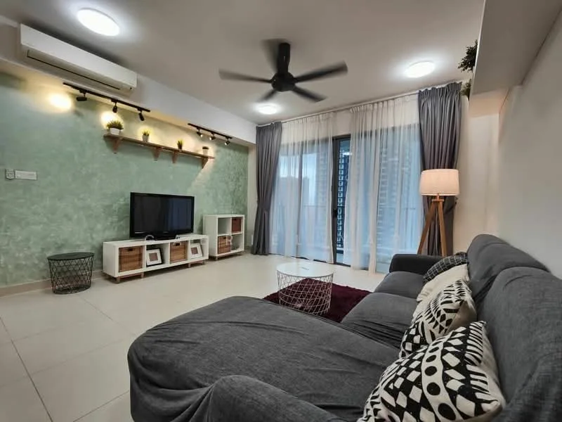 Living features: grey fabric sectional sofa, black and white patterned cushions, white coffee table, TV console with storage, wall-mounted flat-screen TV, green accent wall with texture, recessed LED downlights, ceiling fan with light, curtains in grey, floor-to-ceiling windows, laminate flooring, decorative wall shelves with plants; style: modern; view: city.