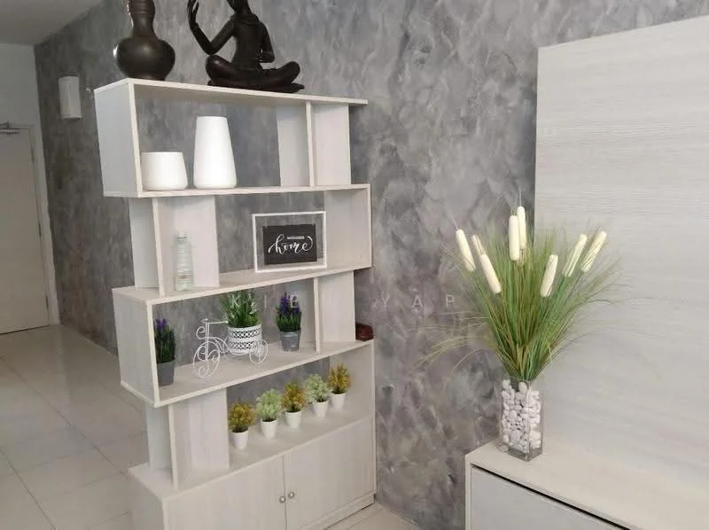 Room features: grey textured wall, white shelving unit, decorative vases, framed artwork with the word 'home', potted plants, decorative stones in a container, buddha statue, white cabinet, ceramic plant pots; style: modern.