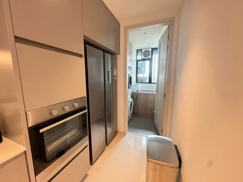 Kitchen features: stainless-steel fridge, built-in oven, grey cabinetry, white countertop, ceramic tile flooring, recessed lighting, single-basin sink, chrome faucet, kitchen trash bin; style: modern. Laundry features: front-load washing machine, dryer, wood cabinetry, tile flooring, window for natural light.