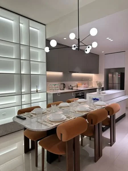 Dining features: marble dining table, 8 upholstered dining chairs in brown, modern pendant light fixture with spherical bulbs, built-in cabinetry with backlit panels, stainless-steel refrigerator, kitchen island with countertop, white cabinetry, recessed lighting, ceramic tile flooring, decorative table setting; style: modern.