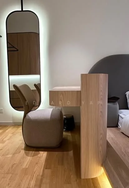 Room features: wooden desk, upholstered stool, oval mirror, soft lighting, wood paneling, light-colored walls, wooden flooring; style: modern.