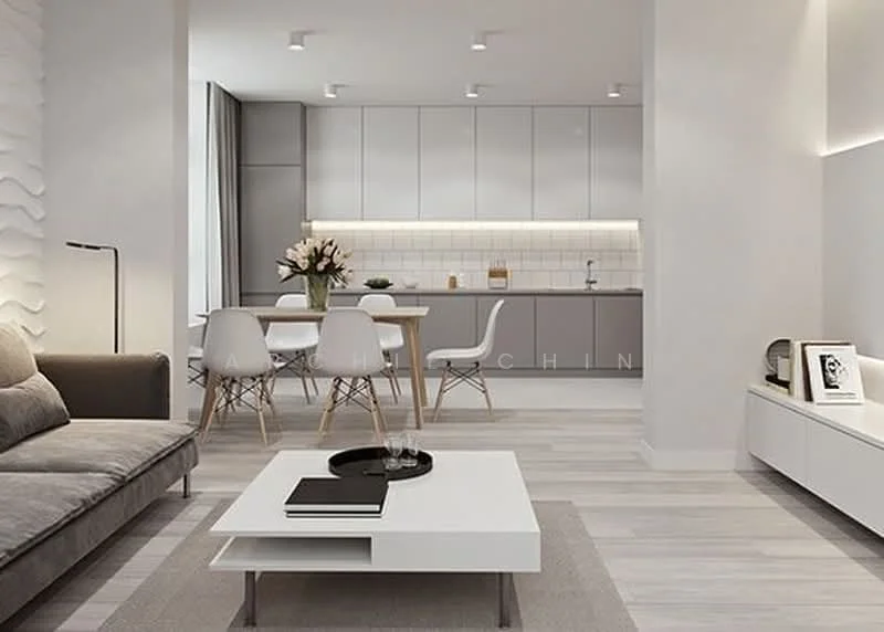 Living features: light grey fabric sofa, white coffee table with open shelf, wooden flooring, recessed LED downlights, floor-to-ceiling windows, decorative wall with wavy texture, area rug, framed artwork, plant in ceramic pot; style: modern. Dining features: 6-seater dining table, white dining chairs, grey cabinetry in kitchen, white backsplash, stainless-steel appliances, kitchen island with seating, pendant lighting above dining table; style: modern.