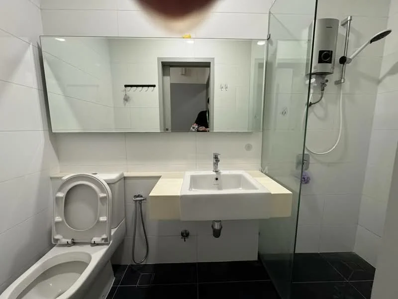 Bathroom features: white tiled walls, black tiled flooring, single-sink vanity with countertop, mirror above sink, shower with glass enclosure, handheld shower, toilet, wall-mounted water heater, towel rack, chrome faucet; style: modern.
