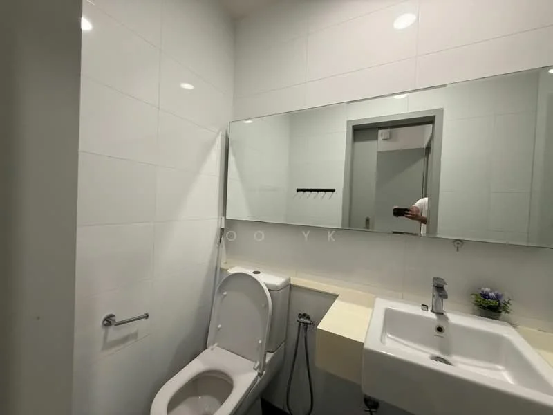 Bathroom features: white tiled walls, light grey floor tiles, single-sink vanity with countertop, chrome basin mixer faucet, framed mirror, one-piece toilet, wall-mounted towel rack, small potted plant on countertop, recessed ceiling lights; style: modern.